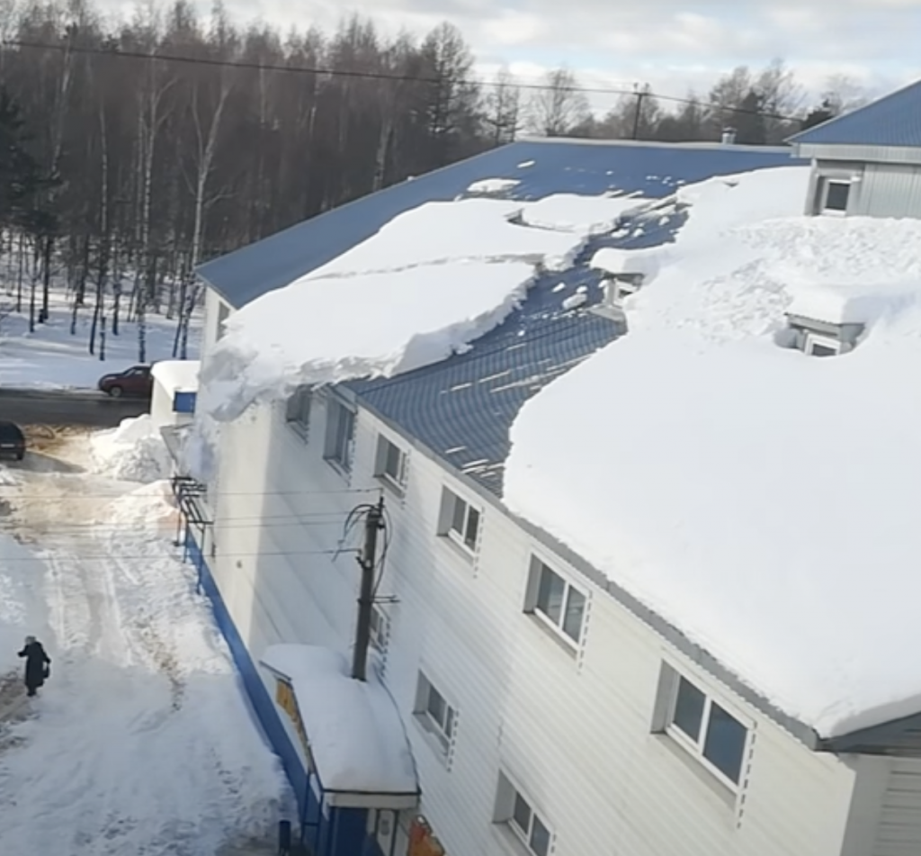 Snow Falling off Slate Roof